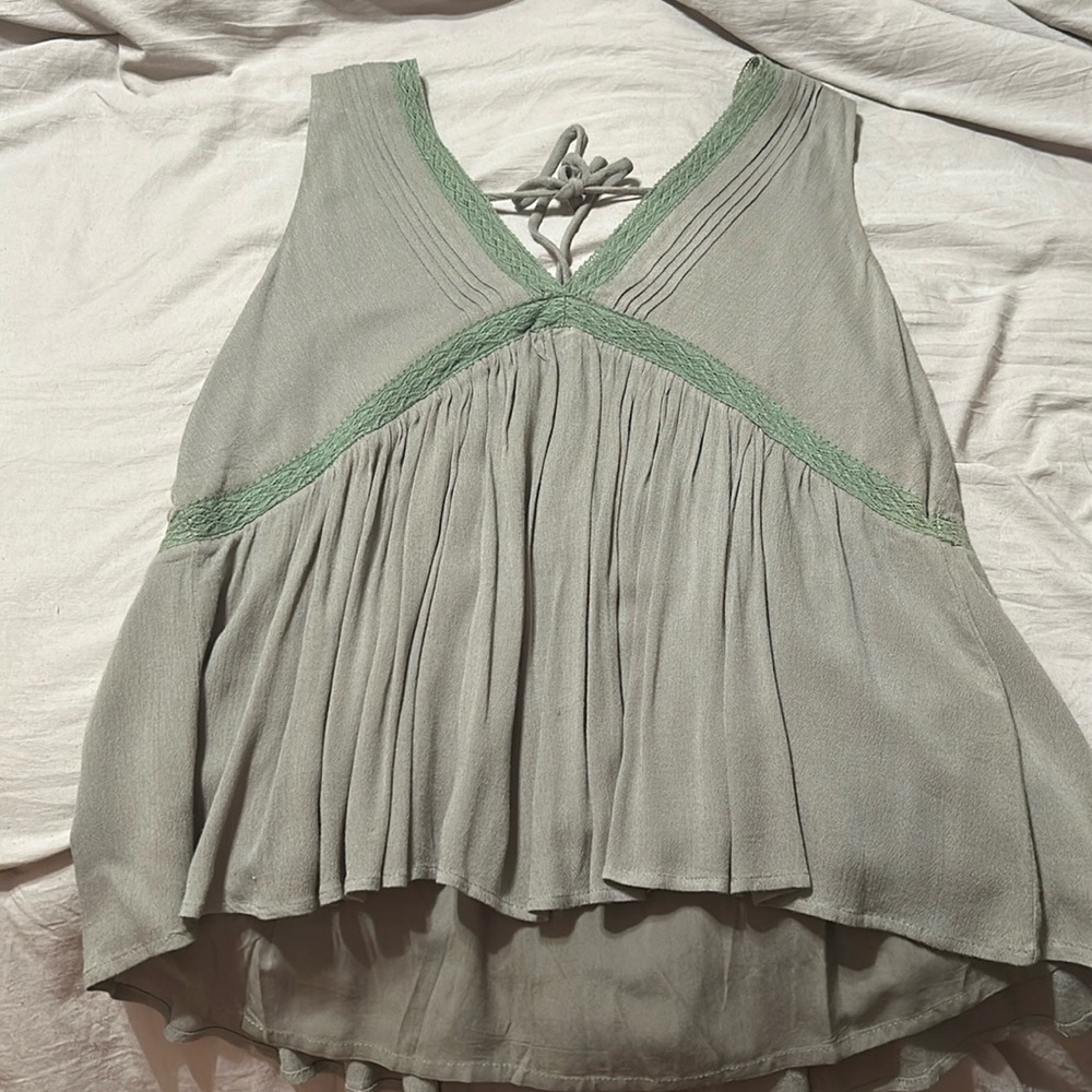 Boutique top. Never been worn. Tie back and flowy. Large